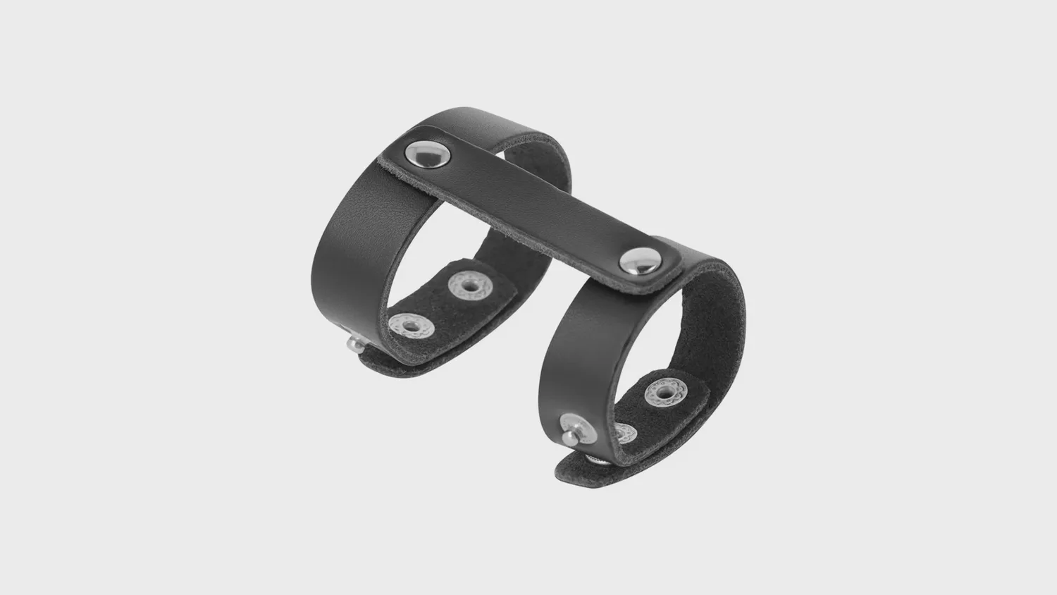 Ballstretcher en sangles de cuir synthétique noir, réglable par boutons-pression