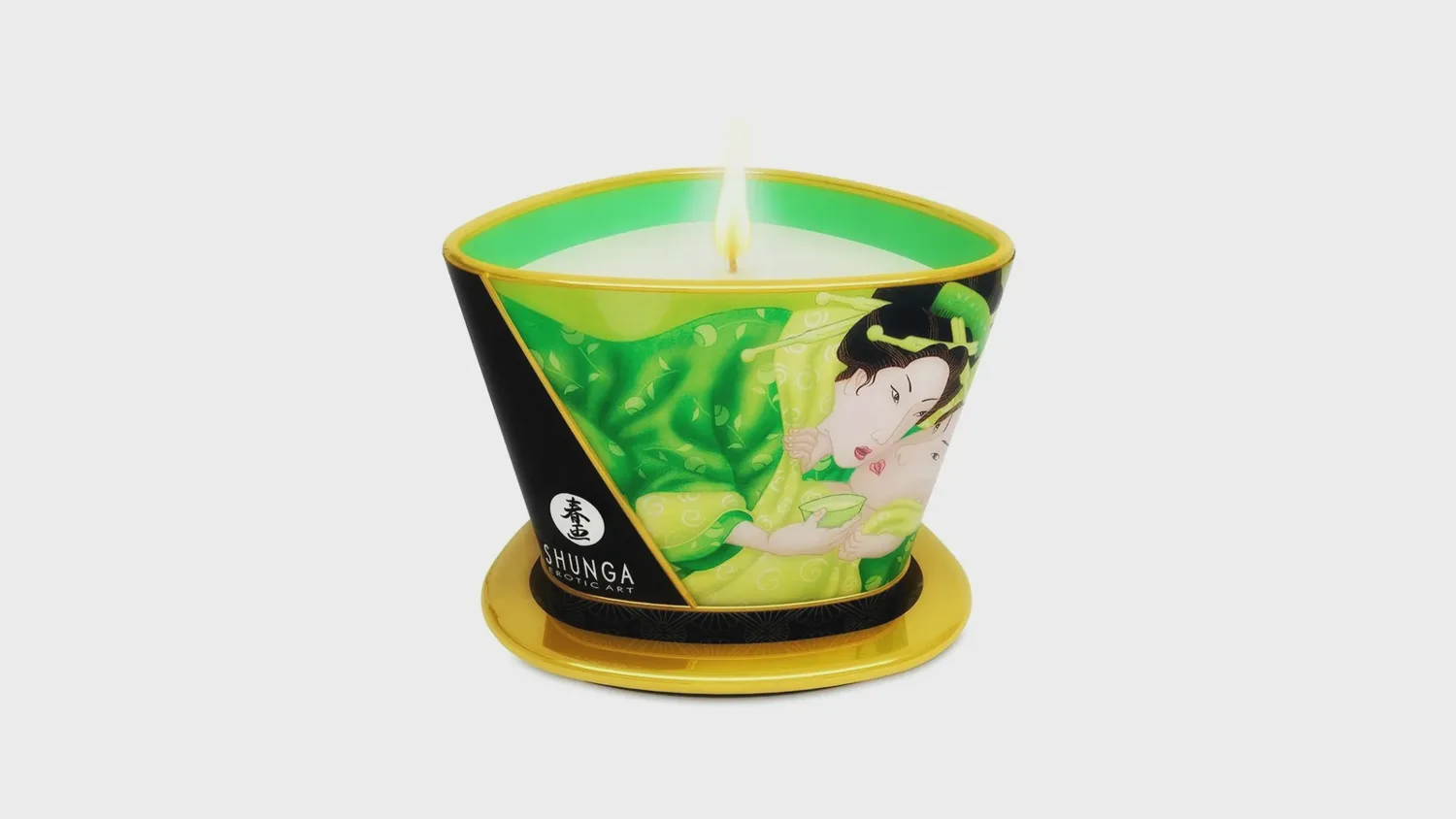 Bougie de massage Shunga thé vert allumée, pot illustré à bec verseur