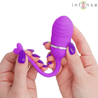 Œuf vibrant Sookie violet tenu en main, tête striée et queue en cœur