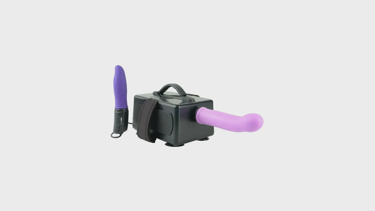Machine à gode Fetish Fantasy à piston, avec gode violet monté et contrôleur filaire posé à côté