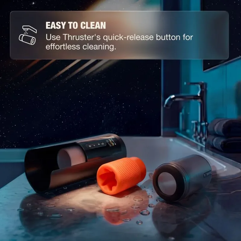 Masturbateur électrique Arcwave Thruster démonté au bord d'un lavabo, manchon orange sorti pour le nettoyage