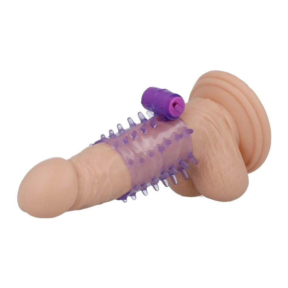 Gaine extensible transparente violet pâle avec picots en relief, accompagnée d'une télécommande violette avec bouton rose, objet pour adultes