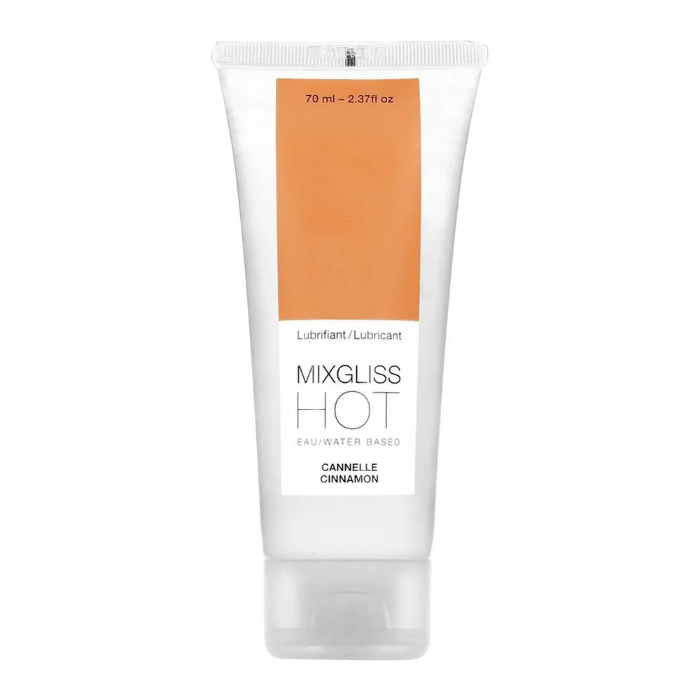 Tube blanc de lubrifiant MIXGLISS HOT à base d'eau, arôme cannelle, 70 ml, avec bande orange et étiquette blanche sur fond uni