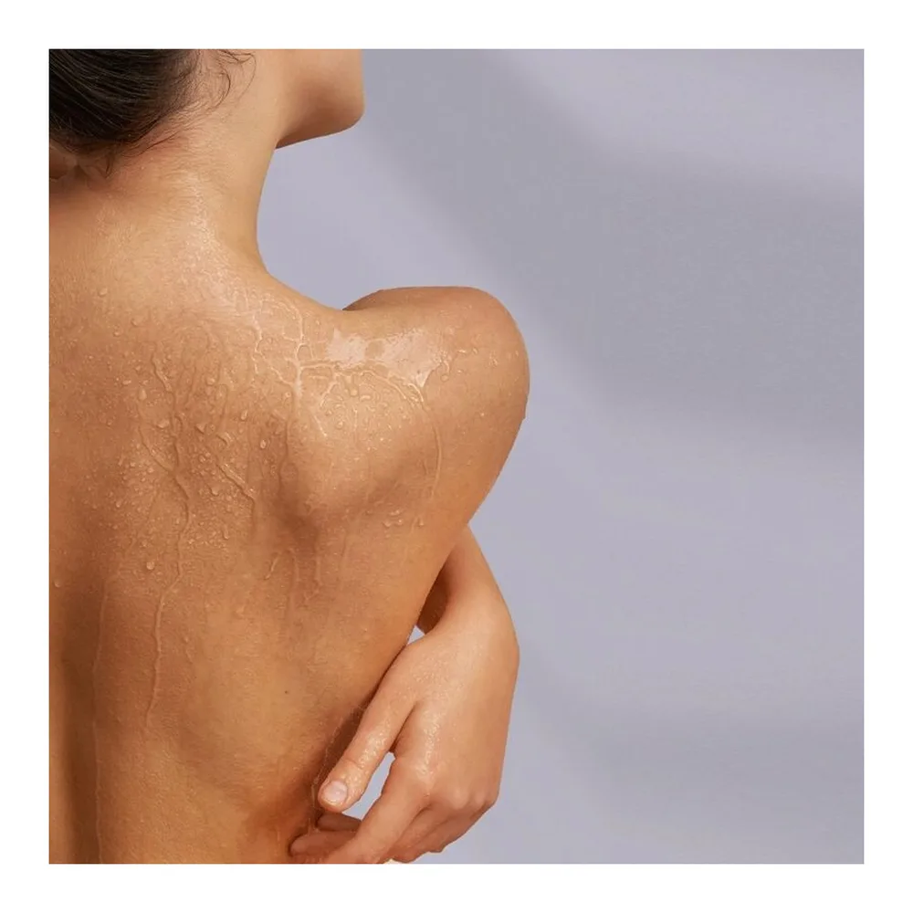 Flacon transparent de gel lubrifiant et massage 2 en 1 à base d'eau, marque Mixgliss Nu, parfum algue-algae, contenance 150 ml, avec étiquette blanche et bande turquoise