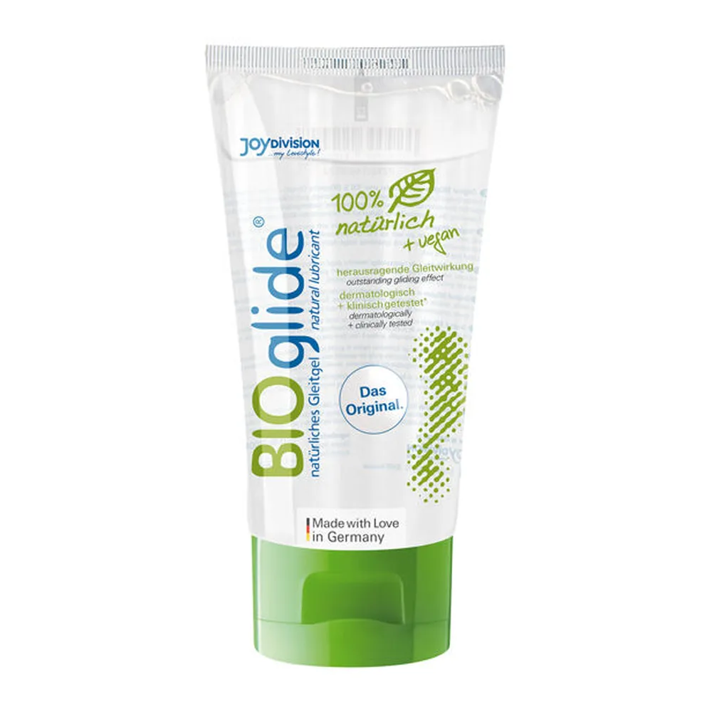 Tube de lubrifiant Bio.glide blanc et vert avec inscriptions en allemand, bouchon à vis vert, étiquette mentionnant 100% naturel et vegan
