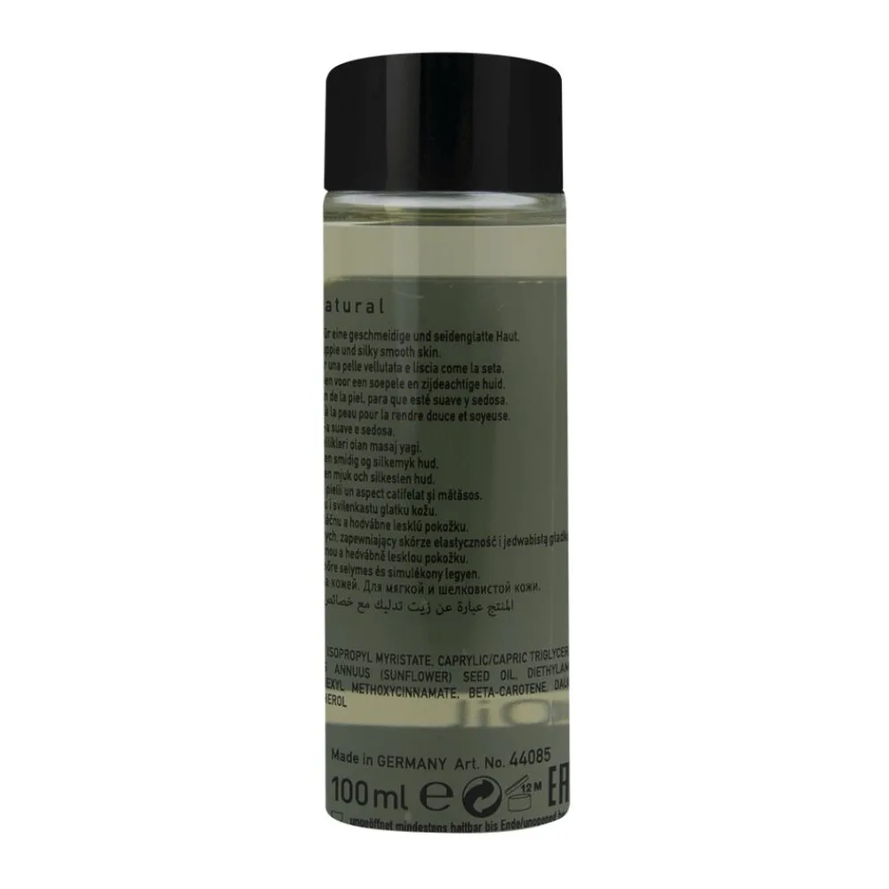 Flacon de 100 ml d'huile de massage naturelle teintée en vert pâle, avec bouchon noir et étiquette détaillée, fabrication allemande