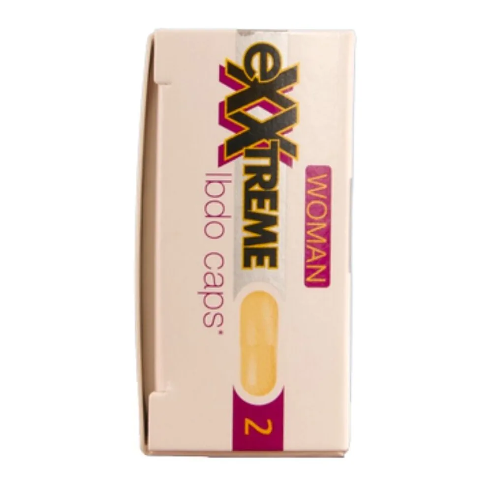 Emballage beige d'un complément alimentaire avec inscription noire, logo vert « VEGAN » et composition détaillée visible sur la face avant