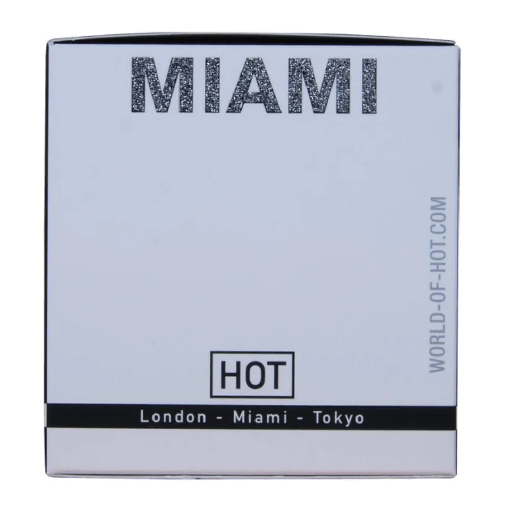 Flacon de parfum aux phéromones Miami Spicy à spray, verre transparent rempli de liquide clair, bouchon pulvérisateur argenté, étiquette grise avec inscription Miami