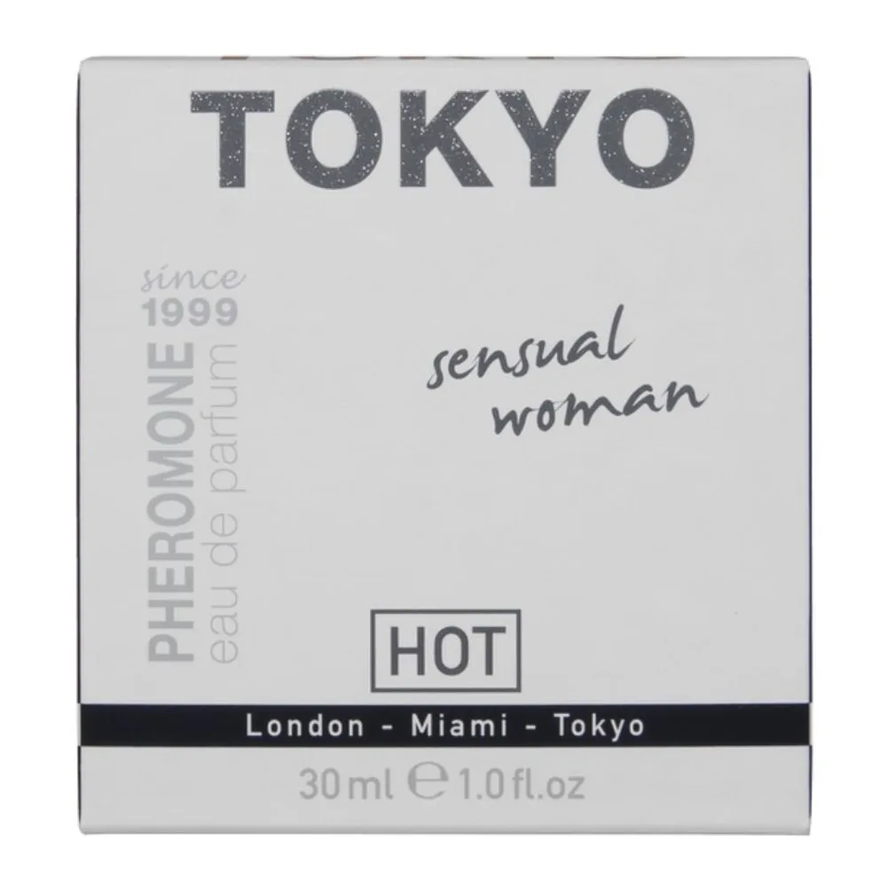 Flacon de parfum aux phéromones Tokyo Sensual en verre transparent, liquide clair teinté jaune pâle, bouchon pulvérisateur chromé, étiquette dorée avec le nom de la marque