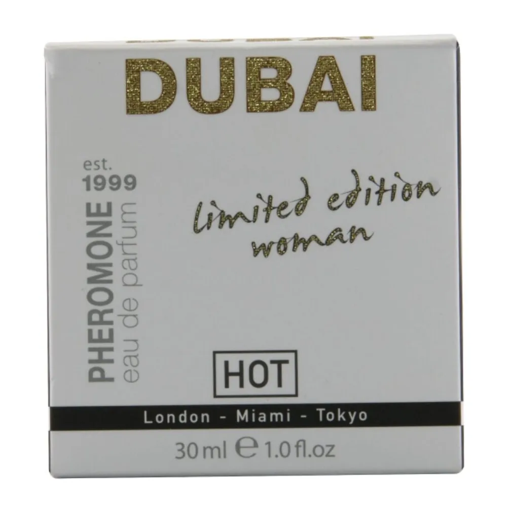 Flacon de parfum aux phéromones transparent avec bouchon vaporisateur doré, étiquette blanc crème gravée DUBAI limited edition woman