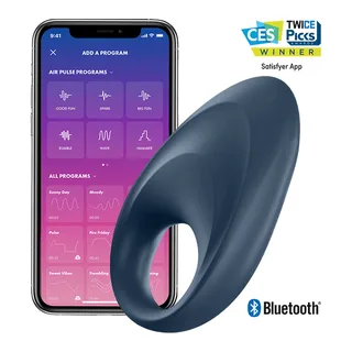 Stimulateur clitoridien Satisfyer posé sur un tissu clair
