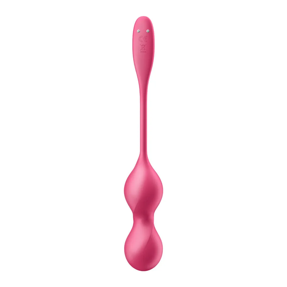 Boules de Geisha rose vif en silicone, deux sphères connectées par une tige fine, design ergonomique, sur fond blanc