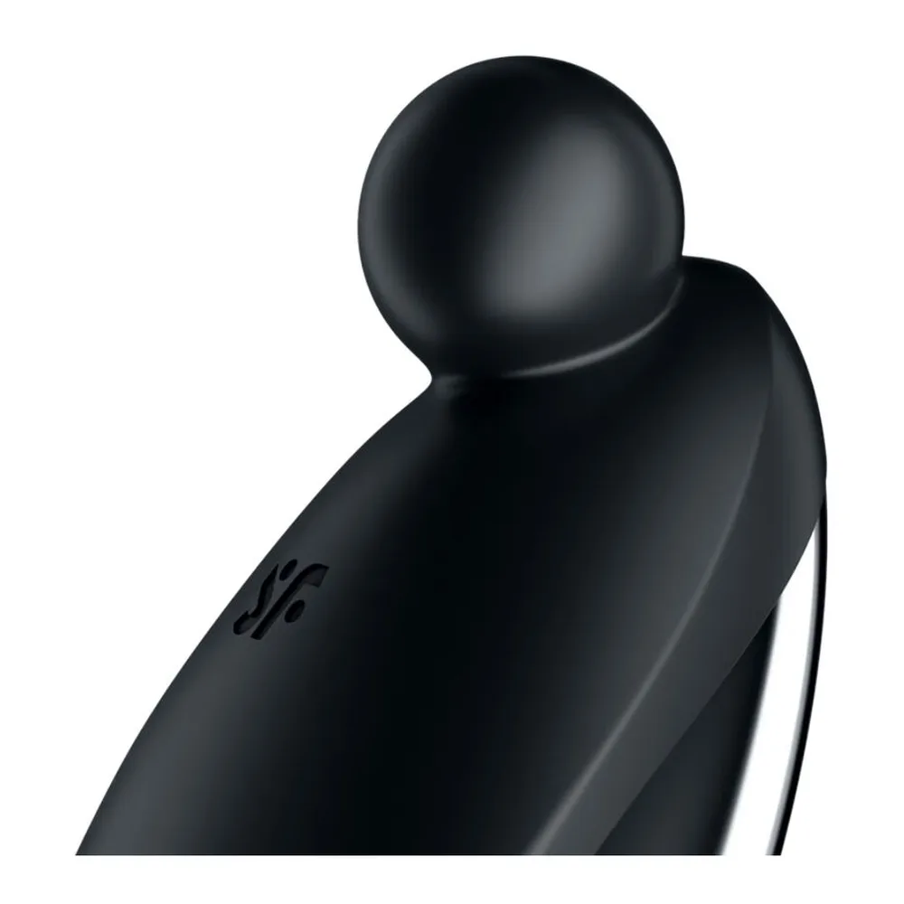 Stimulateur clitoridien noir mat avec pointe ronde bombée au sommet et corps elliptique épais traversé d'une rayure blanche, présenté de profil sur fond blanc