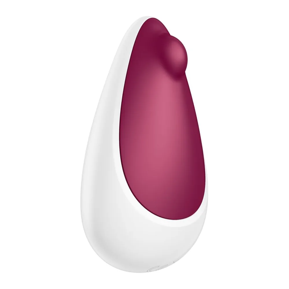 Stimulateur clitoridien Spot On 3 en silicone, forme ovoïde bicolore avec pointe arrondie rose vif sur base blanche, sur fond neutre