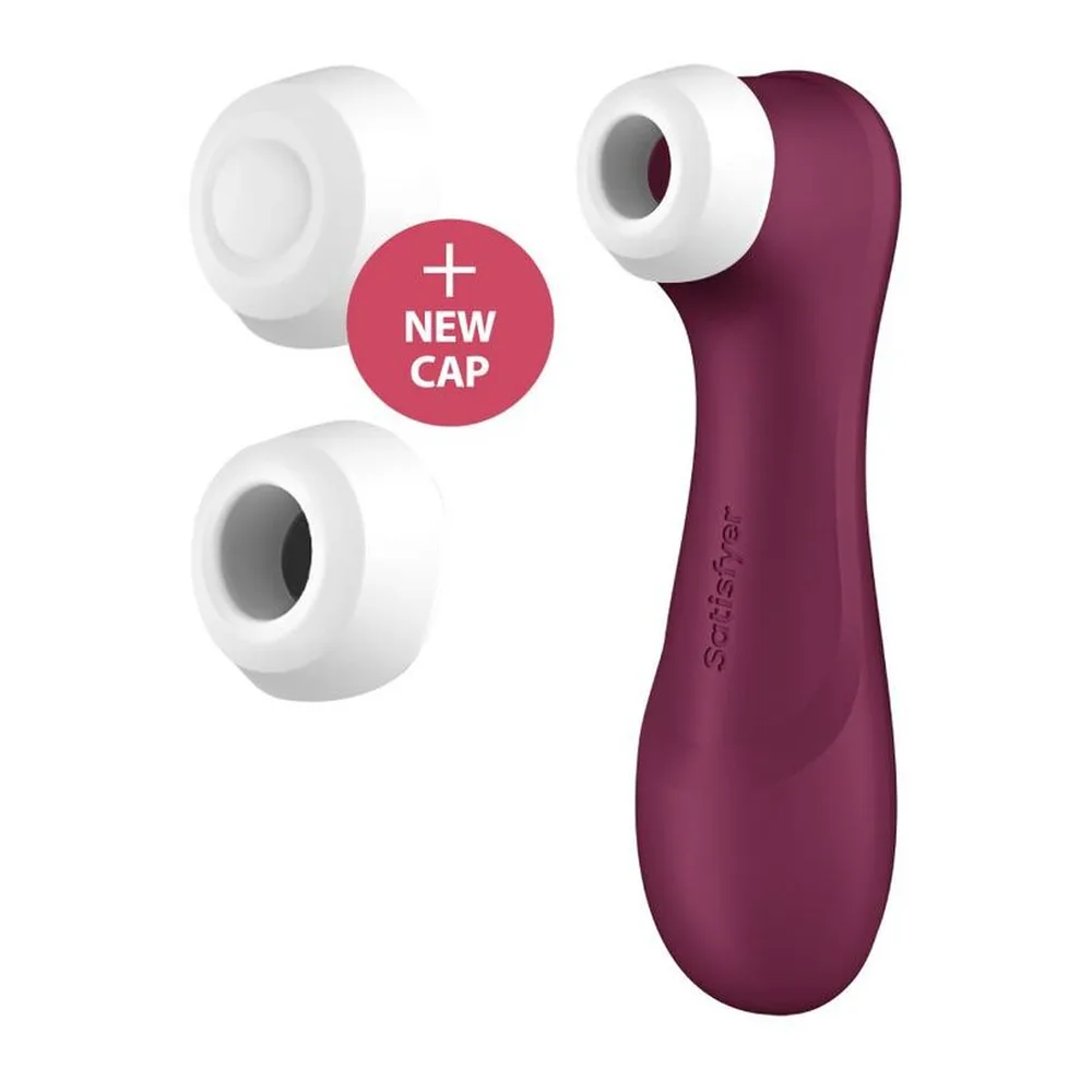 Stimulateur clitoridien rouge lie de vin avec corps ergonomique et embout blanc, accompagné de trois embouts de rechange blancs et d'un badge « NEW CAP »