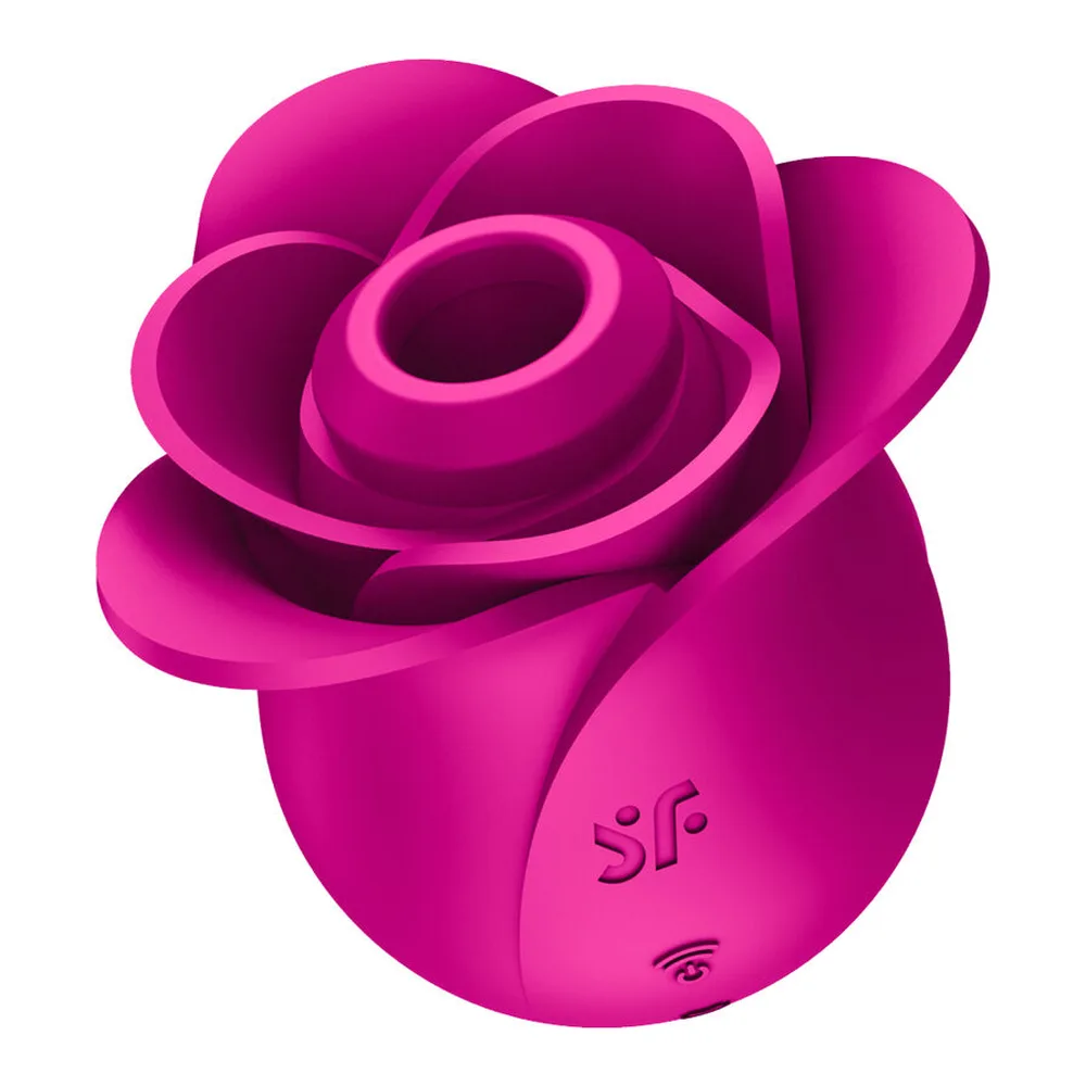 Stimulateur clitoridien en silicone rose vif en forme de rose ouverte, avec pétales arrondis, accompagné d'un nouveau capuchon de recharge et d'un anneau de maintien, sur fond blanc