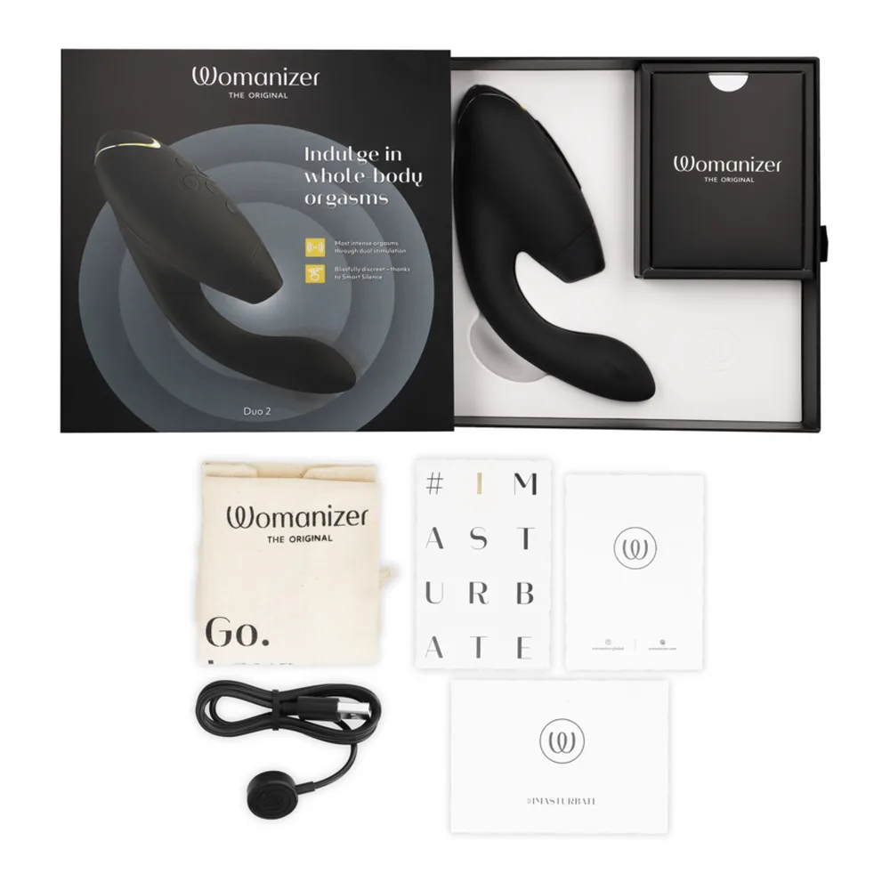 Vibromasseur rabbit noir en silicone avec deux branches courbes, tige centrale et zones texturées, accents dorés, présenté sous trois angles sur fond blanc