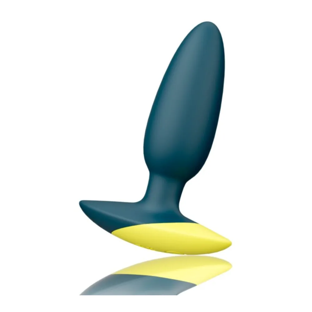 Plug anal de forme ovoïde en silicone bleu-gris, associé à un vibrateur jaune vif avec logo gravé, sur fond blanc