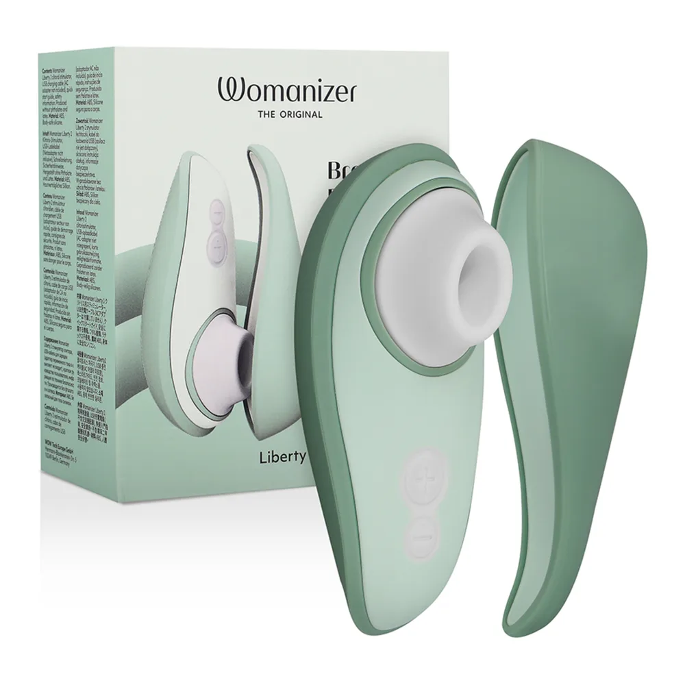 Emballage du stimulateur clitoridien Womanizer Liberty 2 vert sage, montrant le produit et ses caractéristiques avec mentions de technologie Pleasure Air et charge magnétique