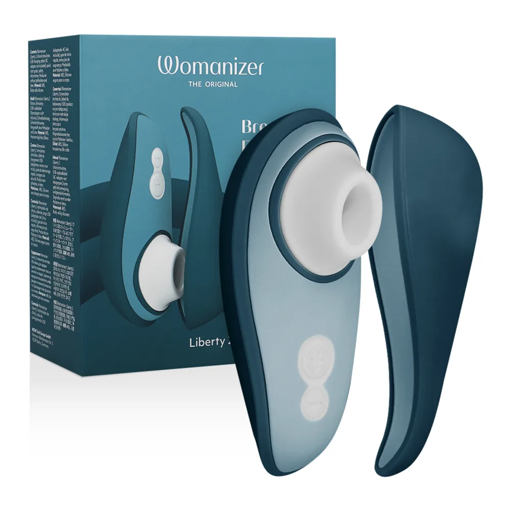 Emballage du stimulateur clitoridien Womanizer Liberty 2 vert sage, montrant le produit et ses caractéristiques avec mentions de technologie Pleasure Air et charge magnétique