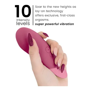 Vibe Lay-On Vibrateur Silencieux Womanizer - accessoires fournis - Rose foncé