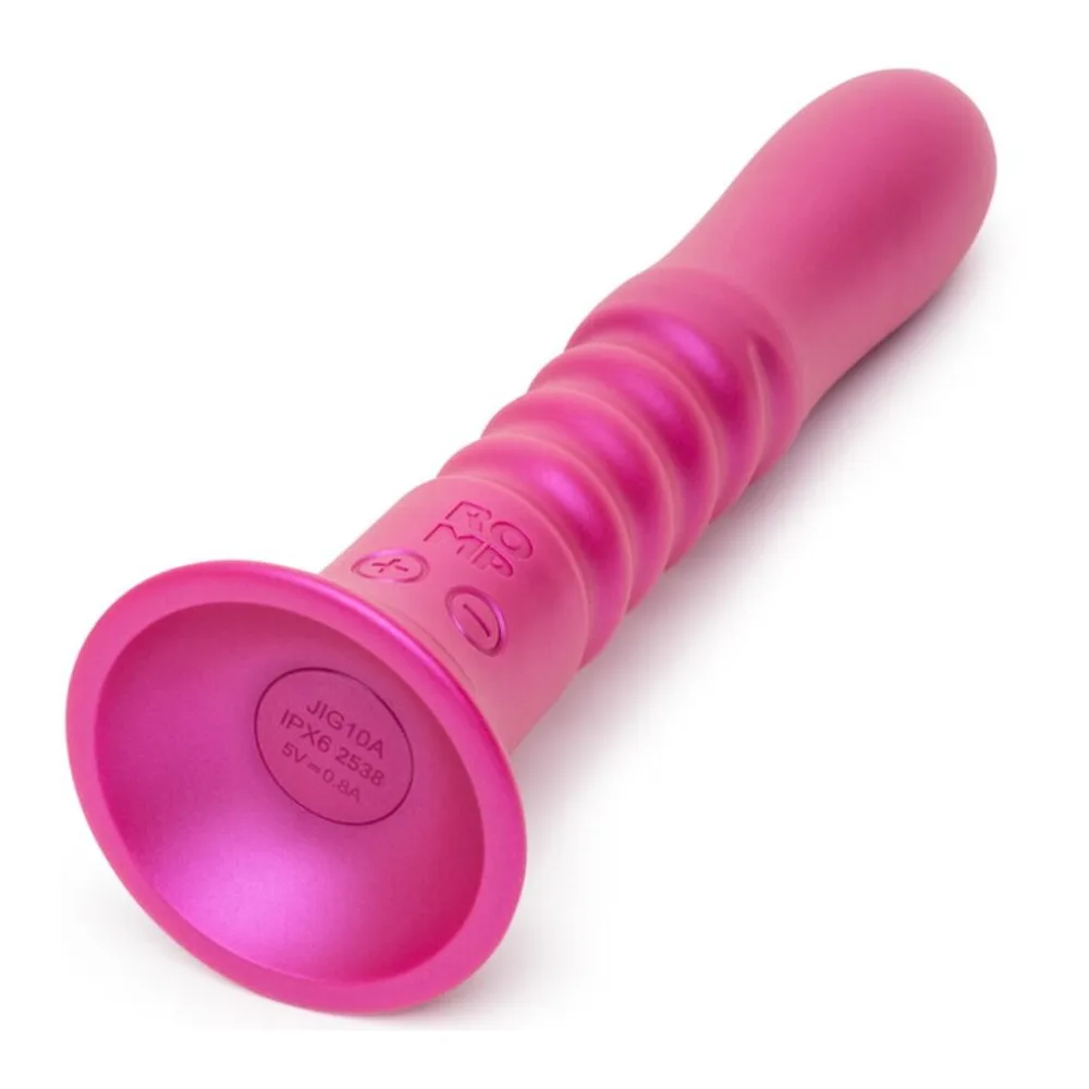 Emballage du vibrateur Jiggle rose vif avec ventouse, boîte dégradé menthe et rose présentant le produit et ses fonctionnalités