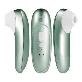 Stimulateur clitoridien Womanizer posé sur un tissu clair