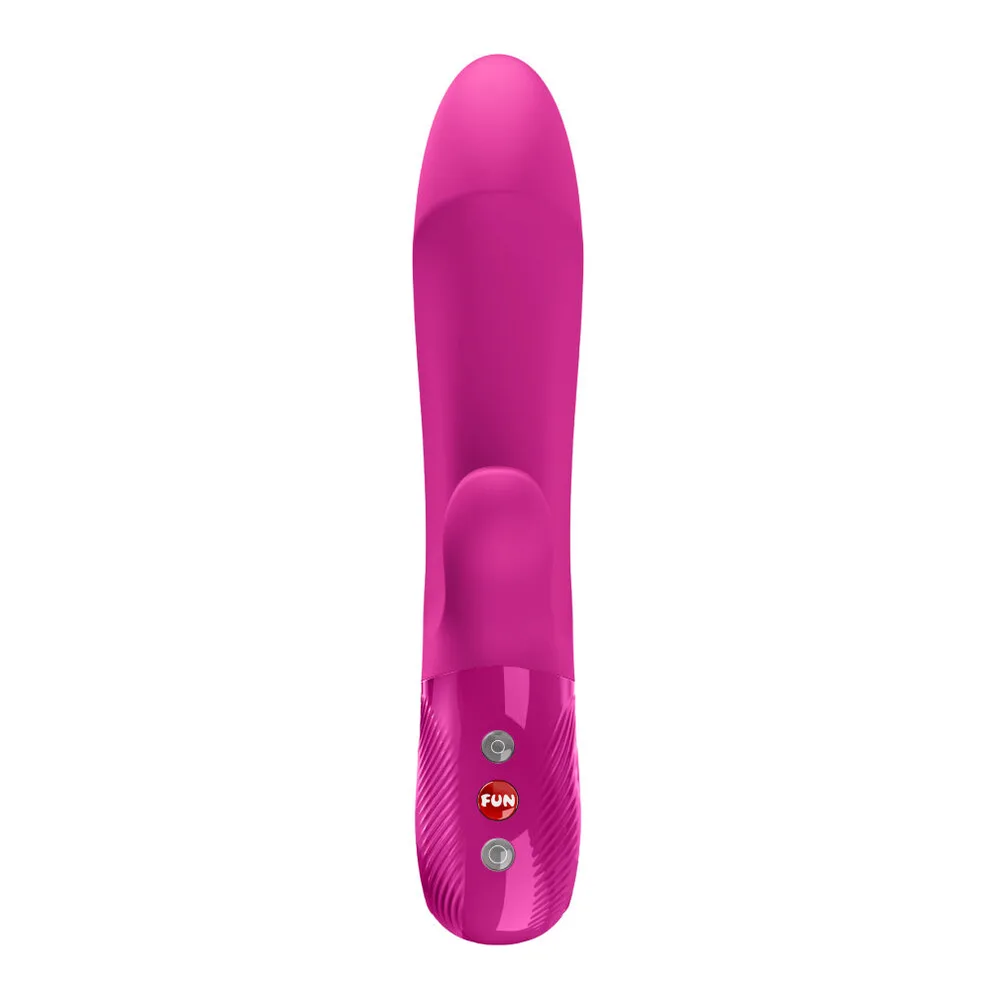 Vibromasseur rabbit rose fuchsia avec tête bulbeuse rainurée, bras interne courbé et poignée en boucle fermée, trois boutons de commande dorés et argentés visibles sur le haut