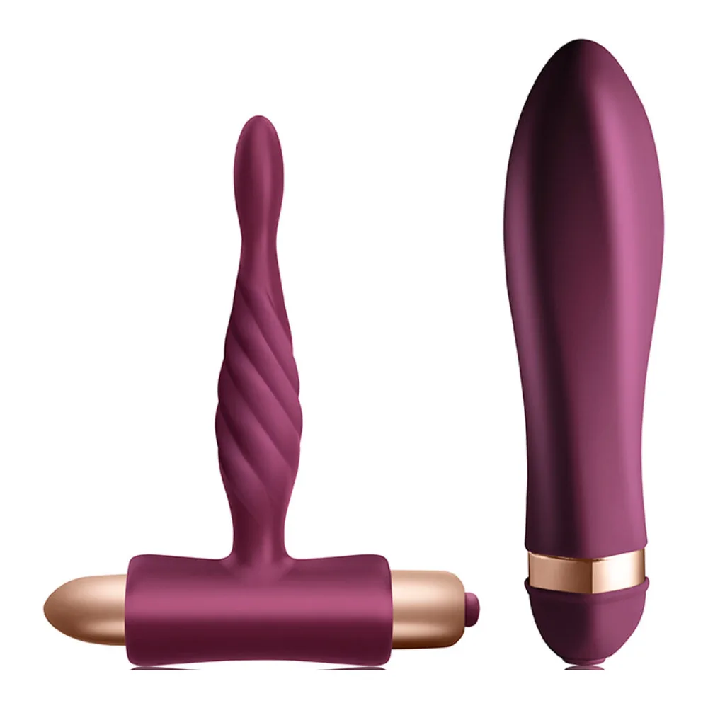 Kit Dare Twisted composé de deux vibromasseurs en silicone bordeaux : une sonde torsadée avec base large et une balle vibrante avec anneau doré, sur fond blanc