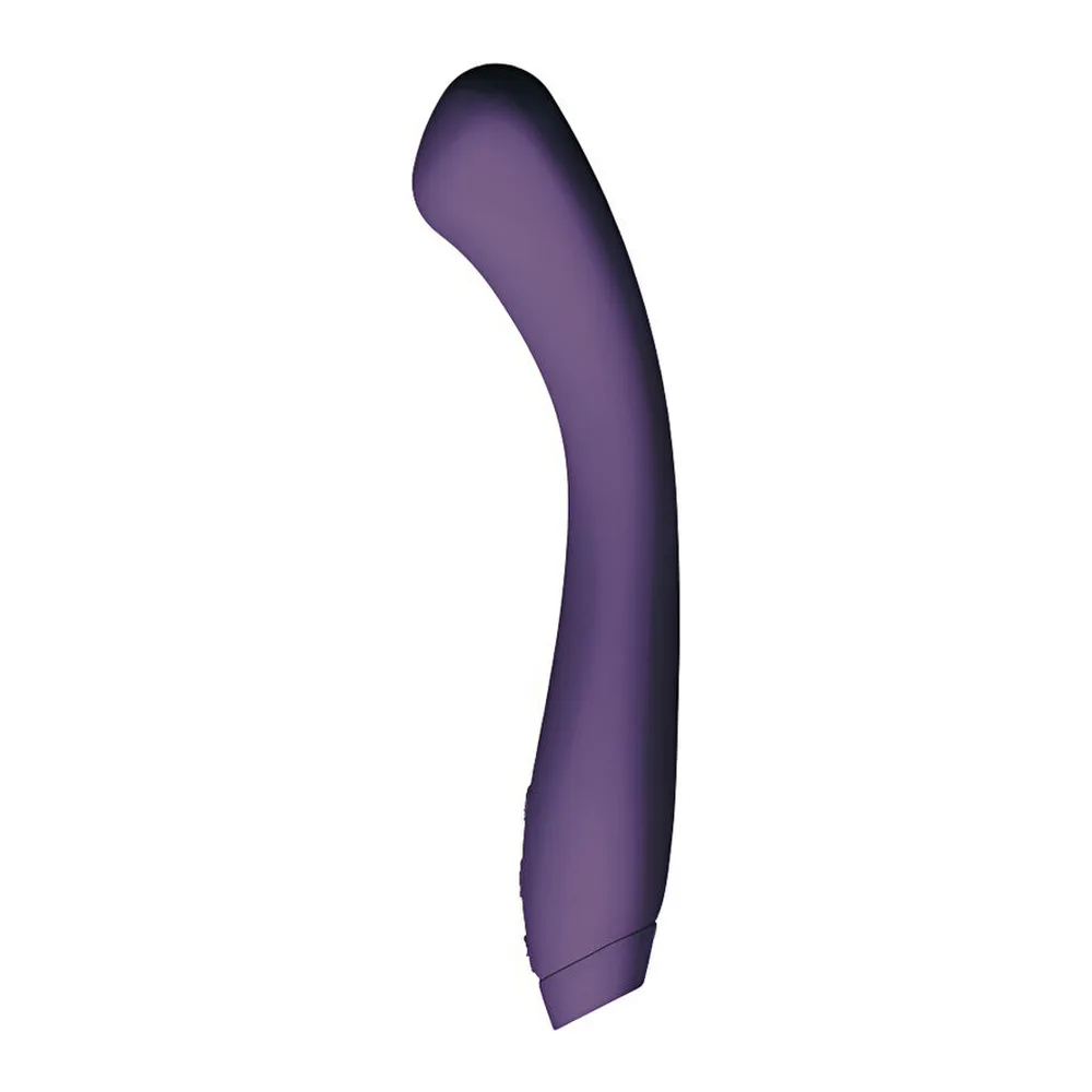 Vibromasseur Juno violet foncé à bout arrondi, tenu en main, montrant sa forme courbe et sa pointe spongieuse