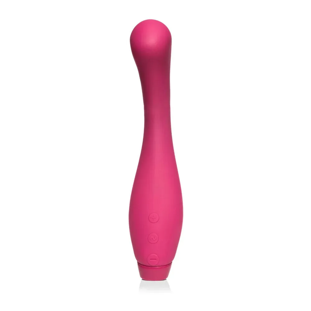 Vibromasseur Juno violet foncé à bout arrondi, tenu en main, montrant sa forme courbe et sa pointe spongieuse