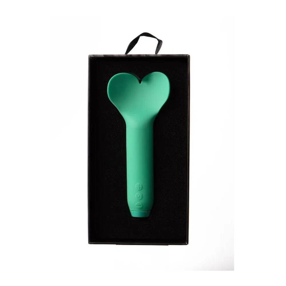 Mini-vibromasseur vert menthe en silicone avec tête en forme de cœur et manche cylindrique texturisé, sur fond blanc