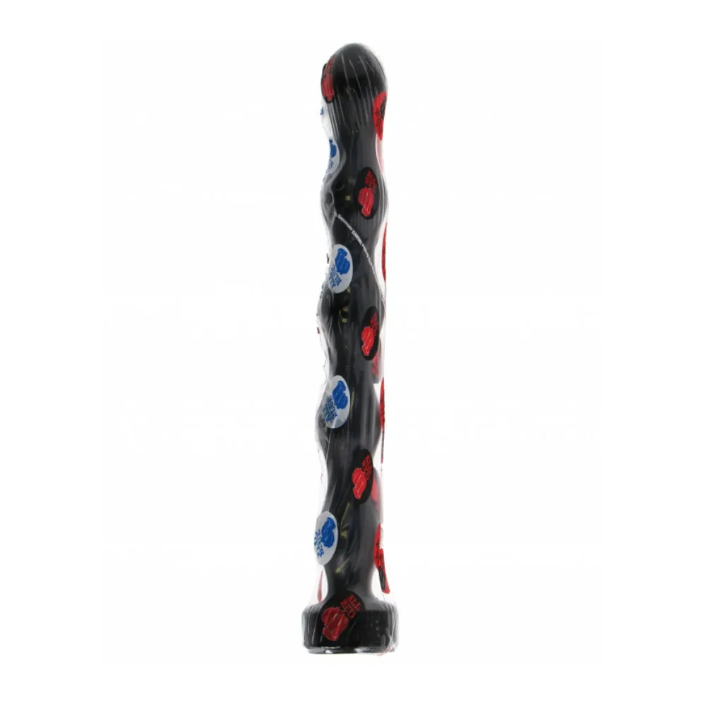 Plug anal noir en silicone avec base large, forme ondulée et renflée, présenté à côté d'une canette de référence de taille