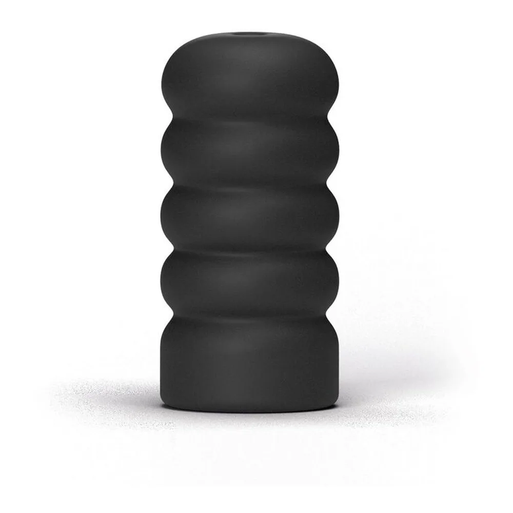 Masturbateur noir en silicone avec contours ondulés et canal intérieur à spirale visible, formes arrondies en haut, fond gris neutre