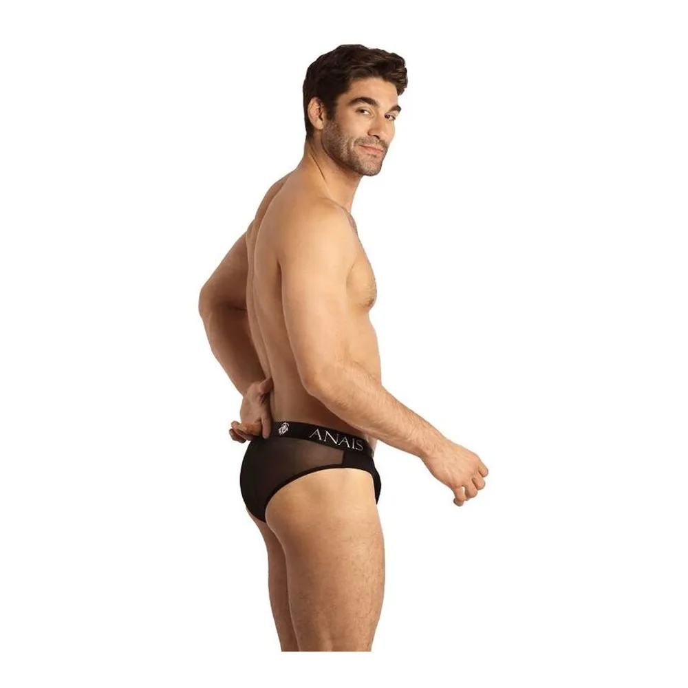 Slip noir Eros porté, tulle extensible avec large ceinture élastique marquée du logo, coupe classique sur fond blanc