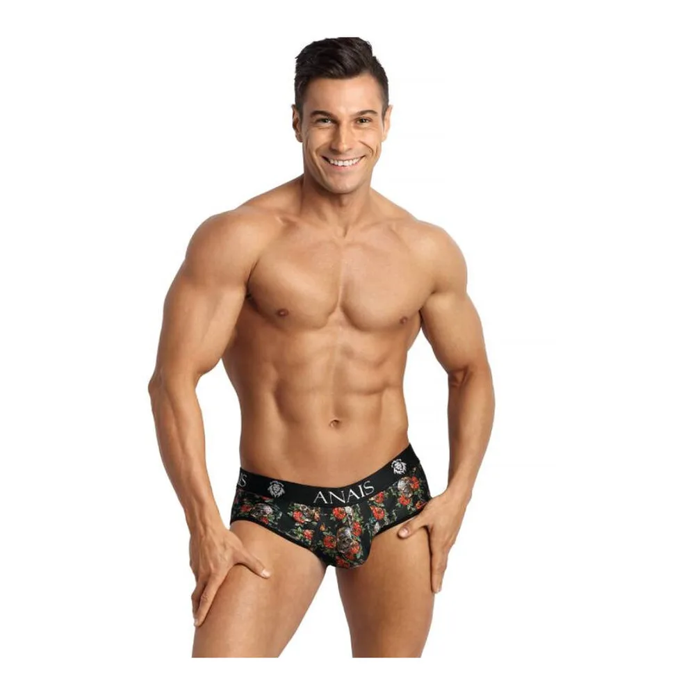 Slip à motif roses et têtes de mort sur fond noir, porté par un homme, avec élastique de marque visible et découpe à l'arrière