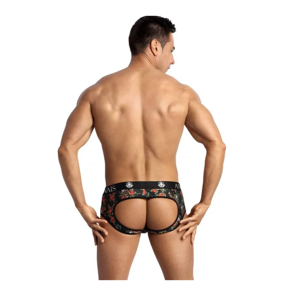 Slip à motif roses et têtes de mort sur fond noir, porté par un homme, avec élastique de marque visible et découpe à l'arrière