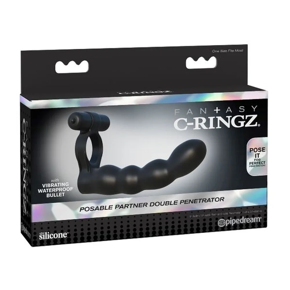Anneau pénétrateur noir en silicone avec bras articulé et vibromasseur, montré en schéma technique avec annotations sur fond blanc