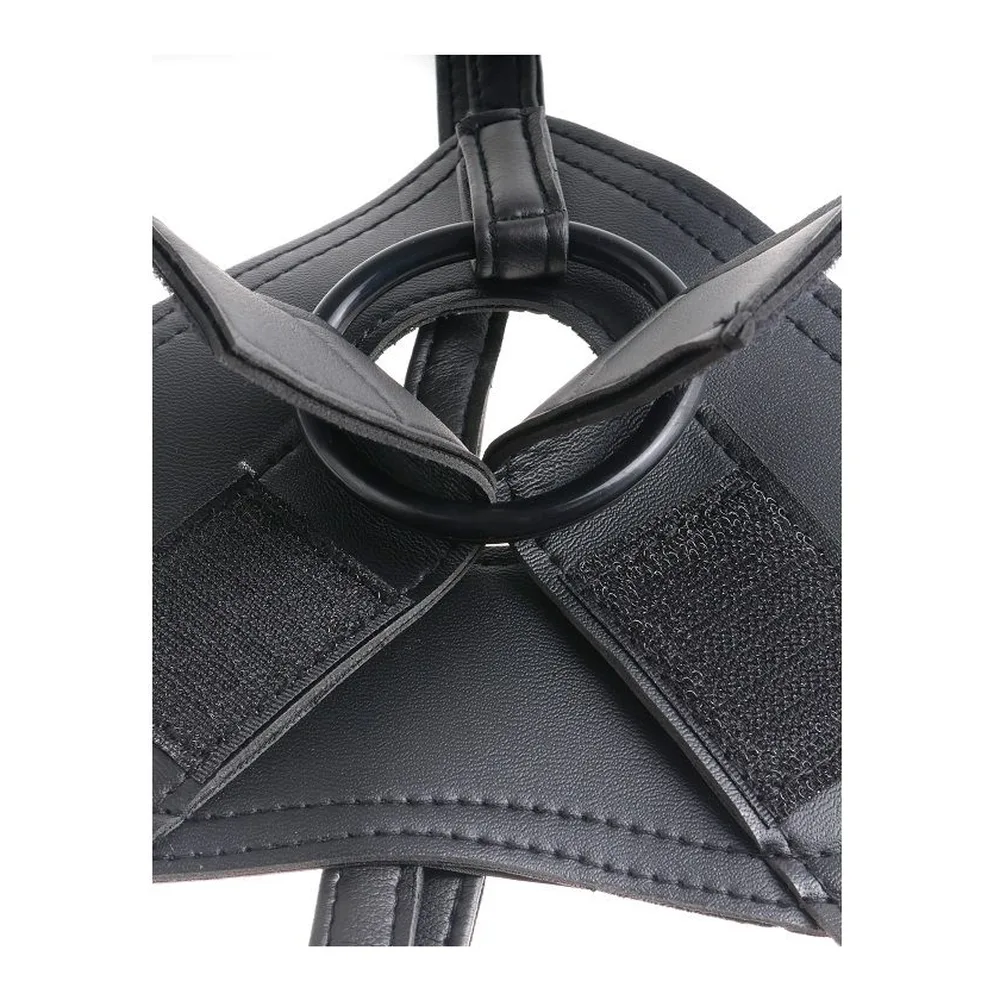 Harnais ceinture-gode en textile avec gode en silicone posé à côté
