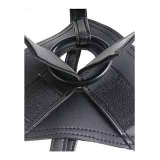 Harnais ceinture-gode en textile avec gode en silicone posé à côté