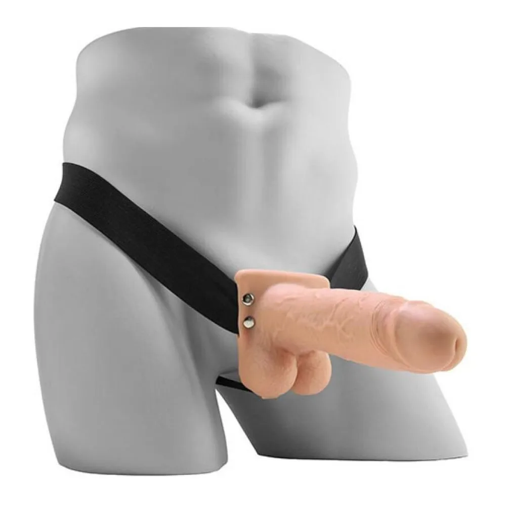 Gode creux réaliste en silicone gris clair avec testicules moulés, équipé d'un harnais noir à sangle centrale, sur fond blanc