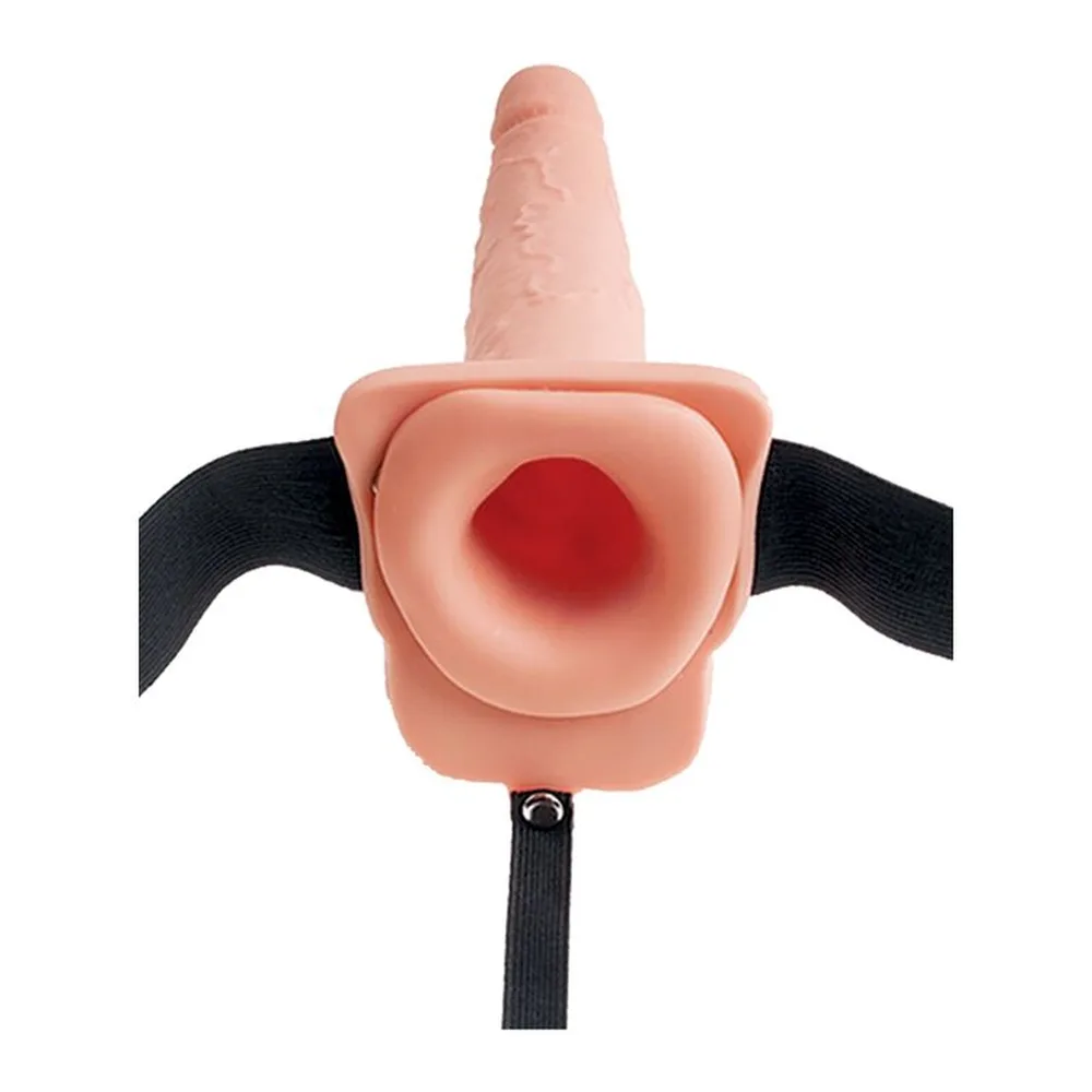 Gode-ceinture en silicone rose chair avec testicules-réservoir rouges, sangle noire ajustable, vue de face montrant l'ouverture centrale