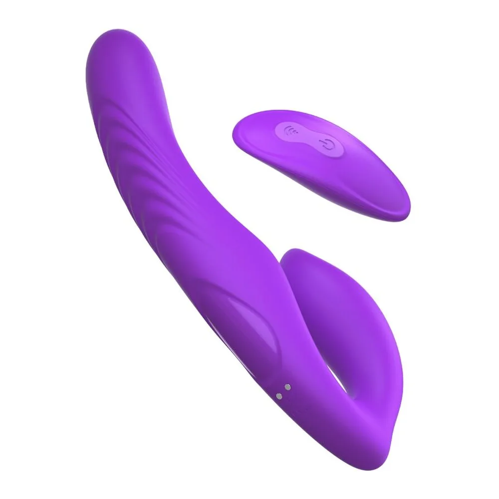 Strap-on violet sans harnais en silicone, forme courbe asymétrique avec deux sections arrondies, l'une plus petite et l'autre plus allongée, surface lisse et brillante sur fond blanc