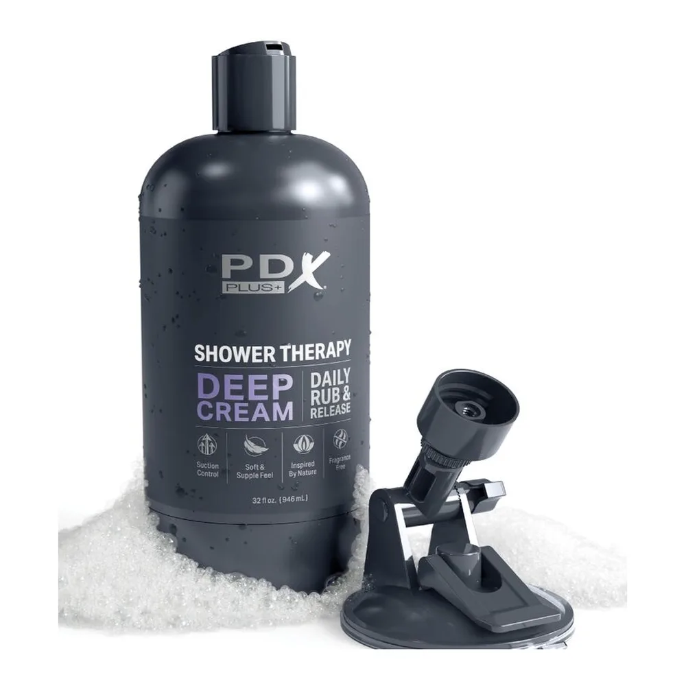 Masturbateur Deep Dream noir en forme de flacon de douche, fixé par ventouse sur surface blanche, avec étiquette blanche et base argentée