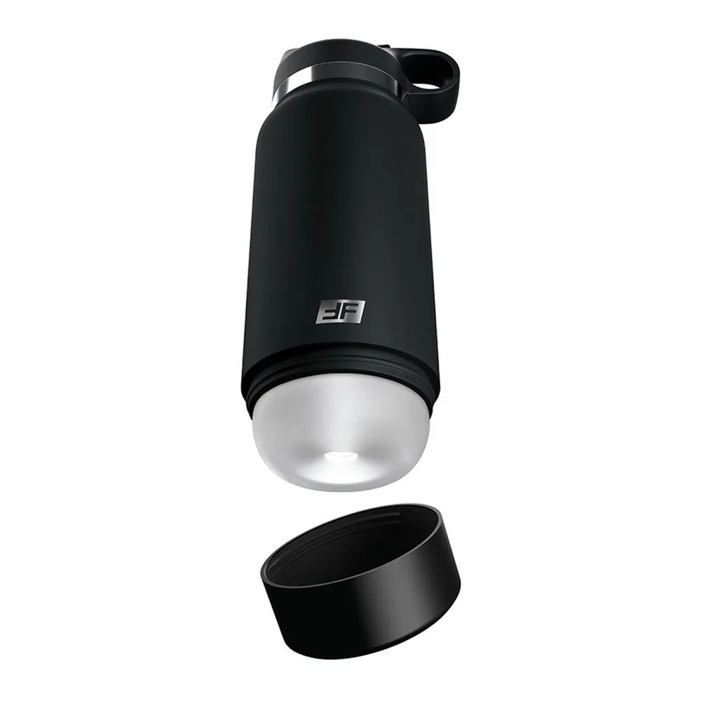 Bouteille noire avec bouchon et poignée, base transparente révélant l'intérieur blanc texturé, accompagnée d'un anneau noir détachable, sur fond blanc