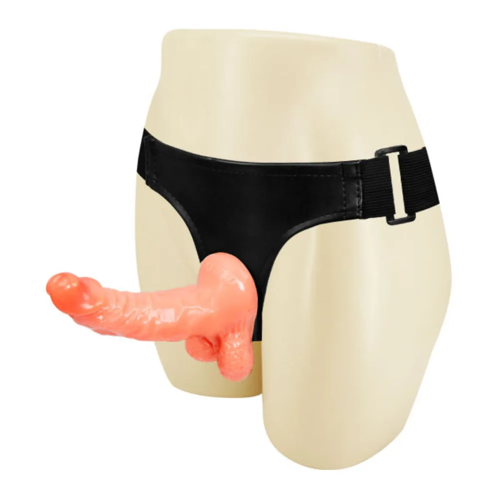 Harnais-culotte noir avec gode réaliste rose en vinyle, sangle réglable avec boucle de fermeture, fond blanc