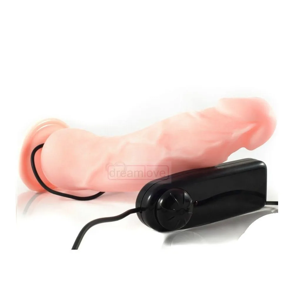 Vibromasseur réaliste en silicone rose clair avec tête glandulaire, base large, et télécommande filaire noire avec contrôle d'intensité, sur fond blanc