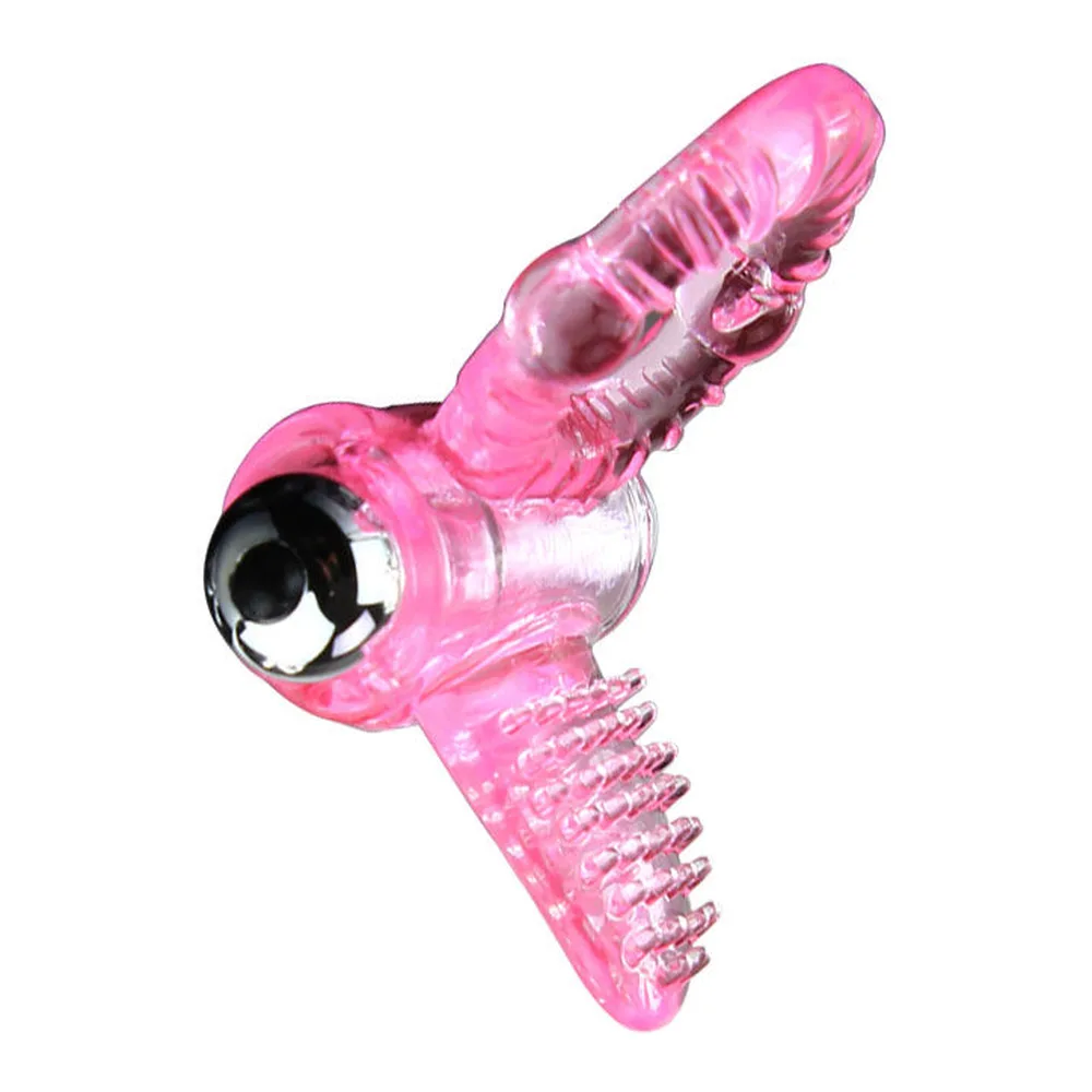 Cockring vibrant rose transparent avec boules de massage, tête amovible dotée de picots, poignées noires sur les côtés, vue de face sur fond blanc