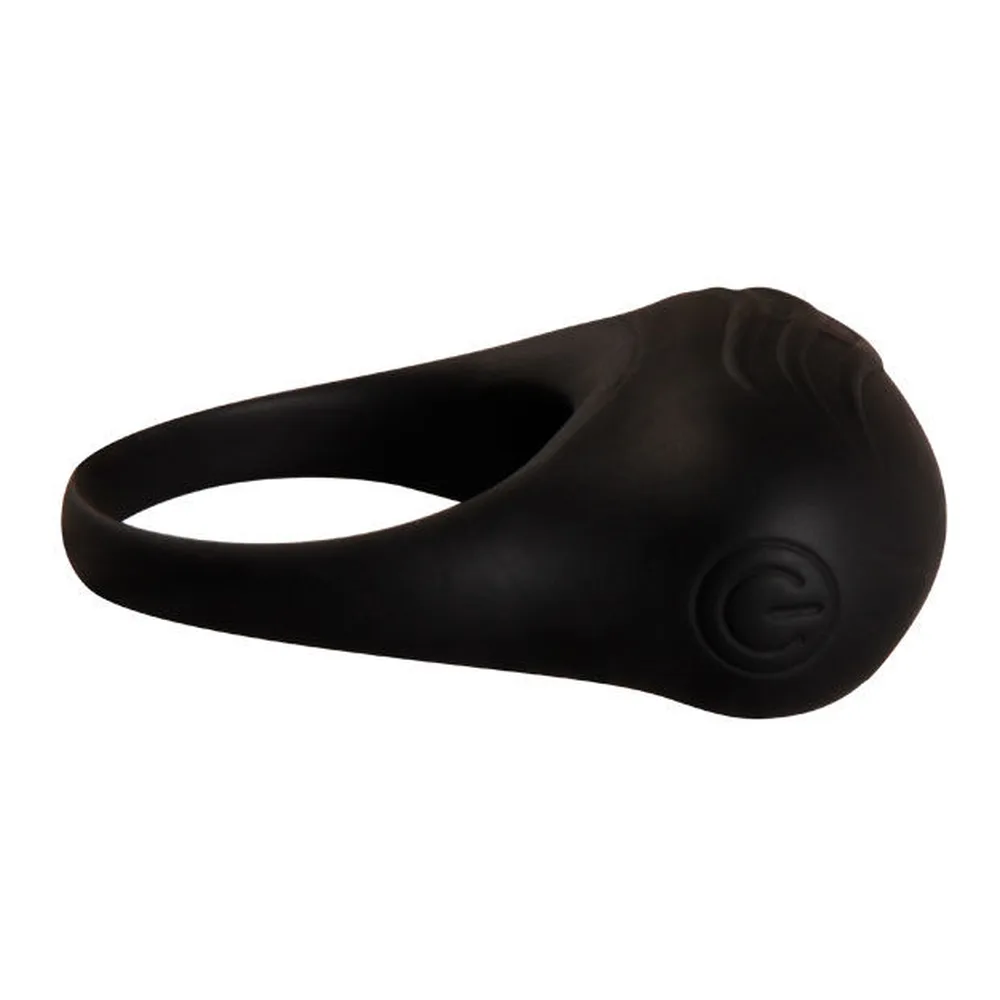 Anneau vibrateur en silicone noir avec ouverture centrale, présenté avec sa balle vibrante détachable de forme ovale et son bouton de commande