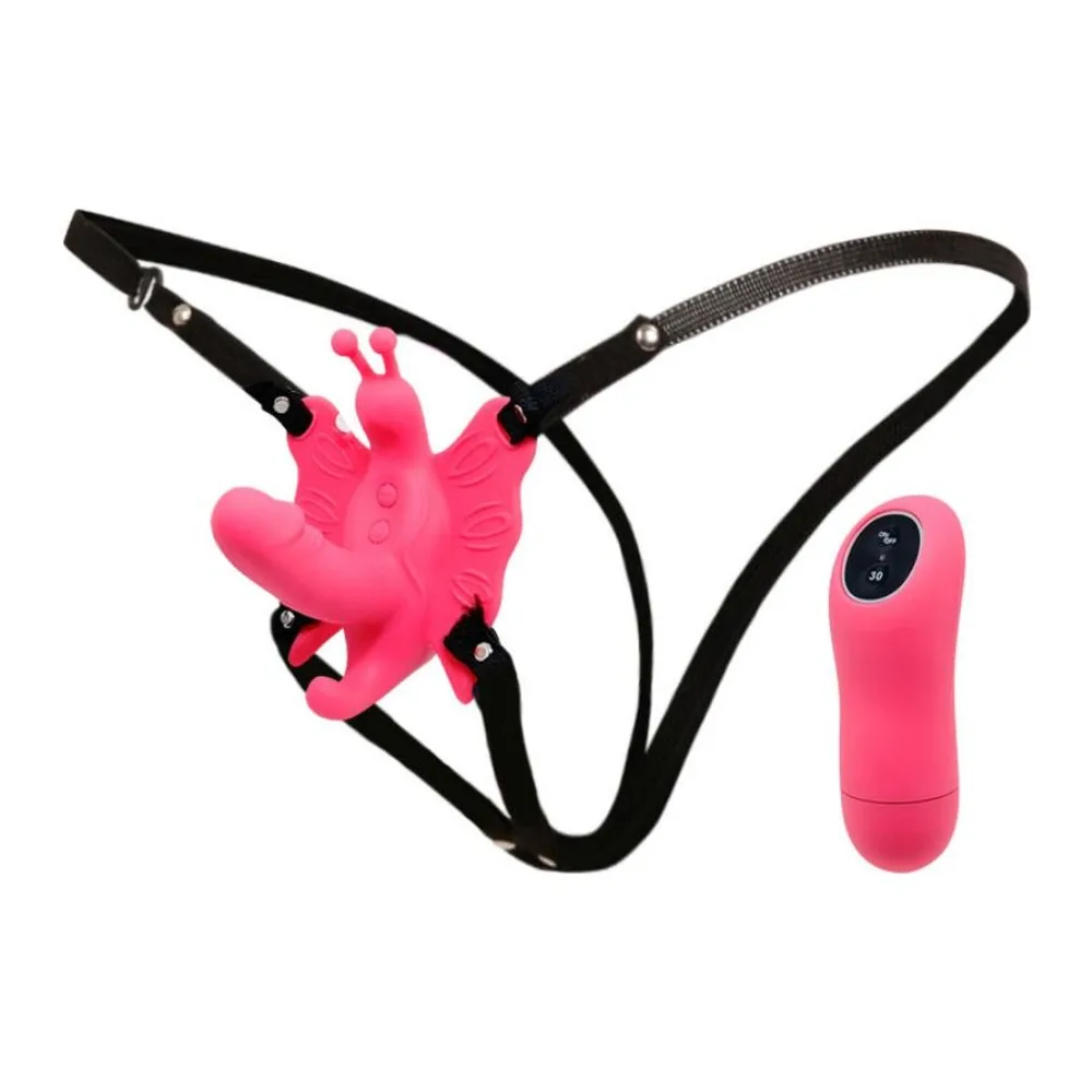 Harnais papillon en silicone rose vif avec sangles noires ajustables et télécommande rose associée, sur fond blanc